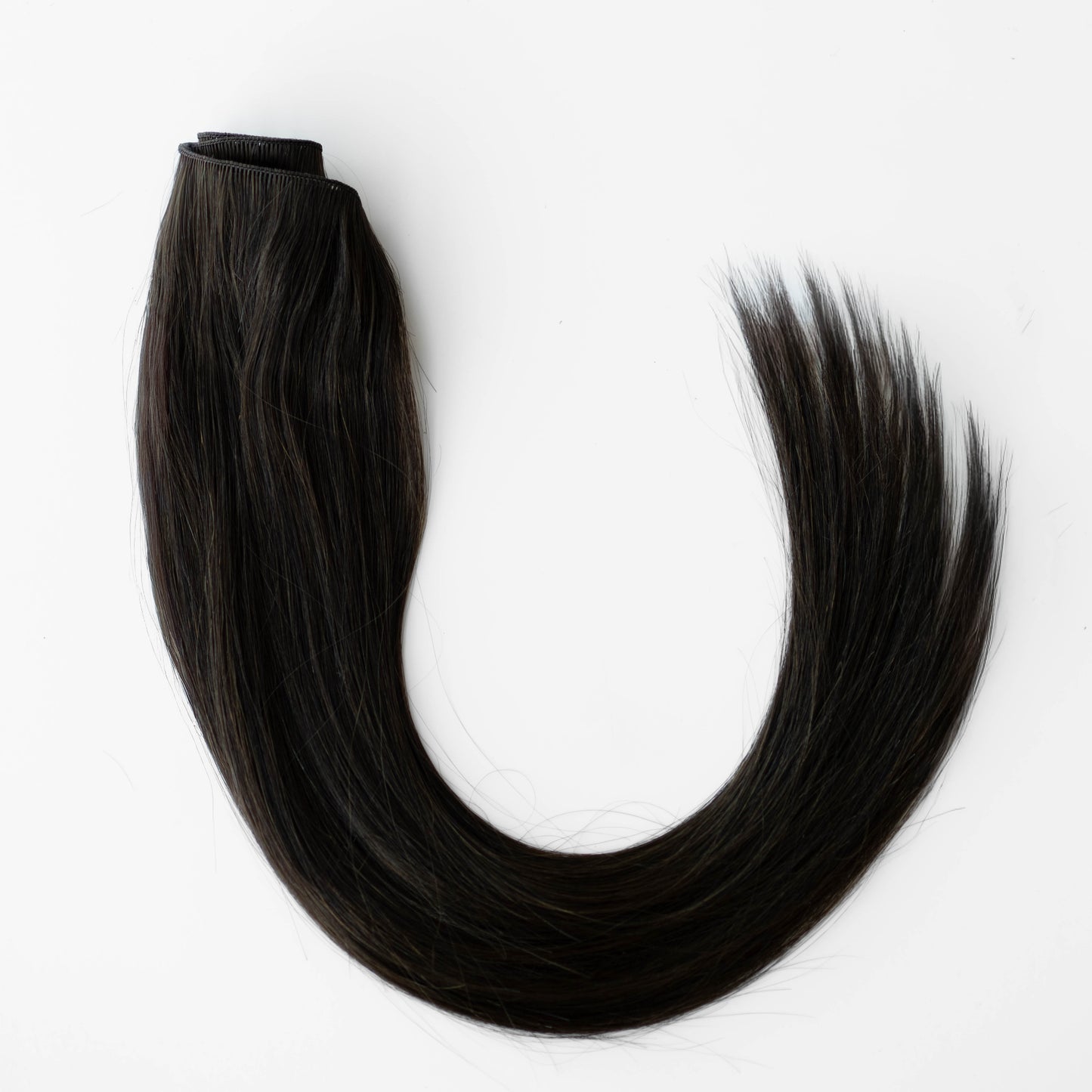 Dark Brown hair extension on a white background