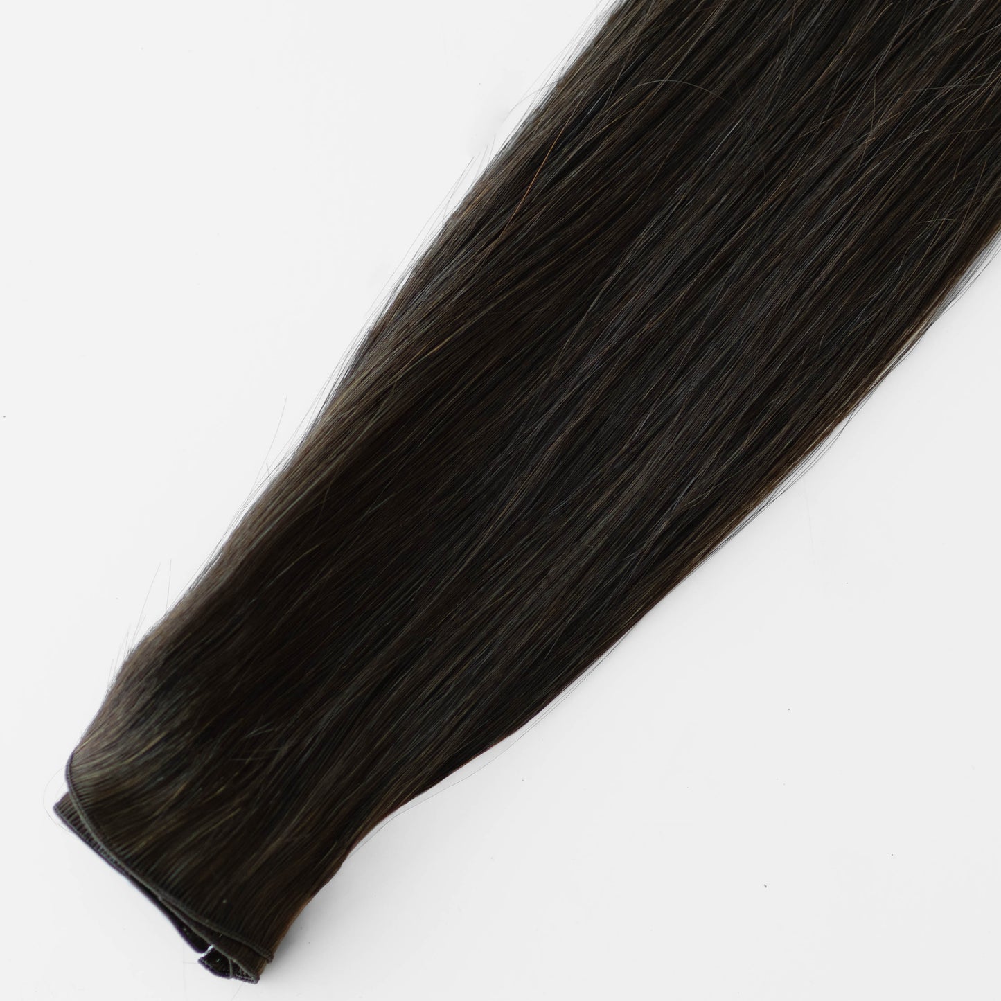 Dark Brown hair extension on a white background