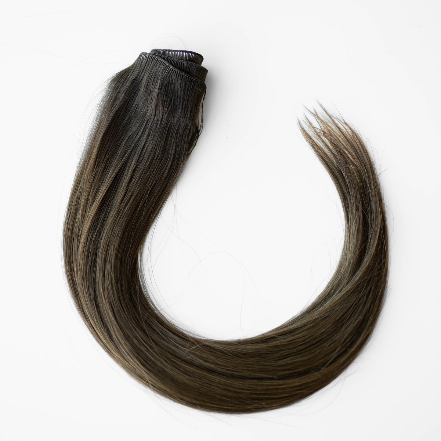 Brown hair extension on a white background