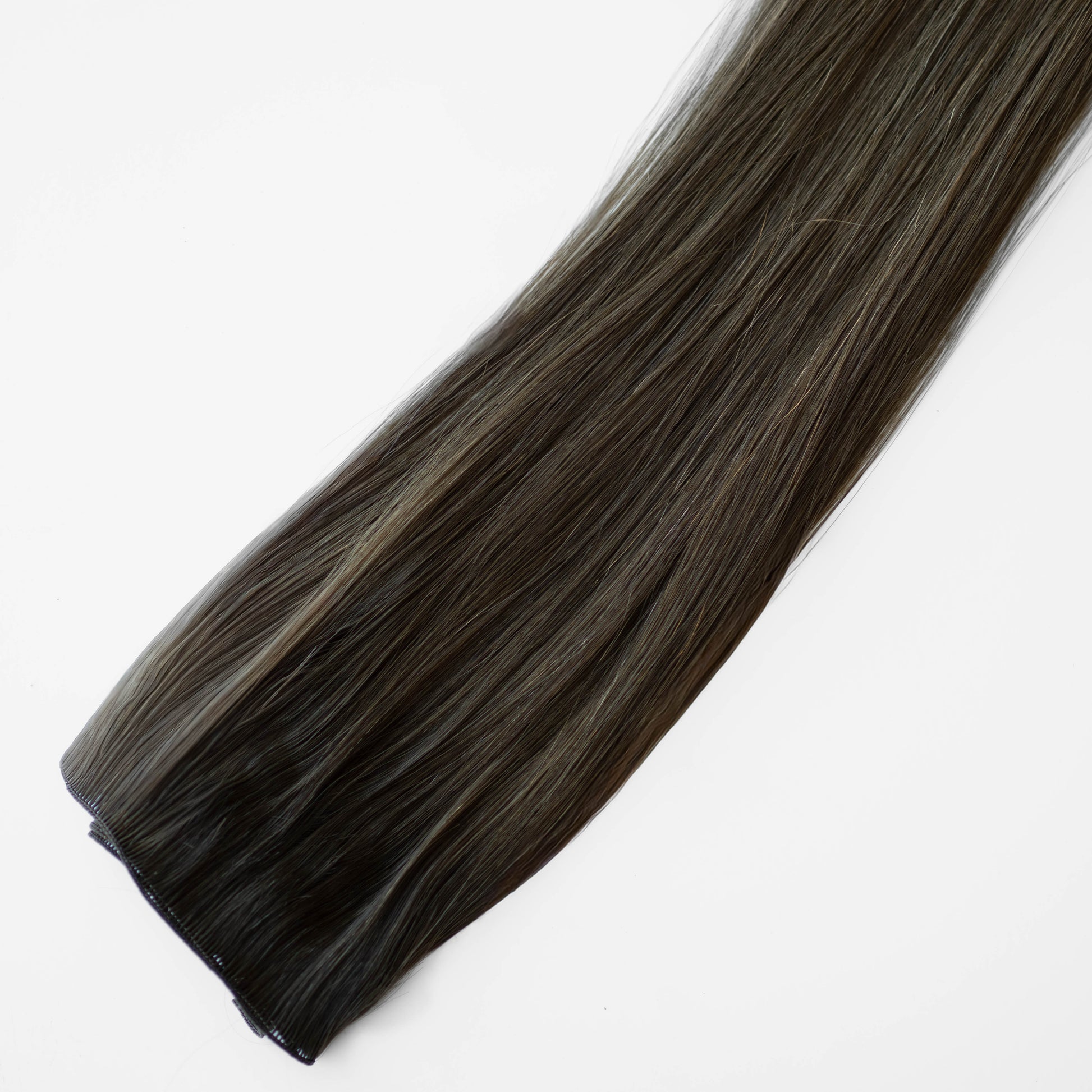 Dark brown hair extension on a white background